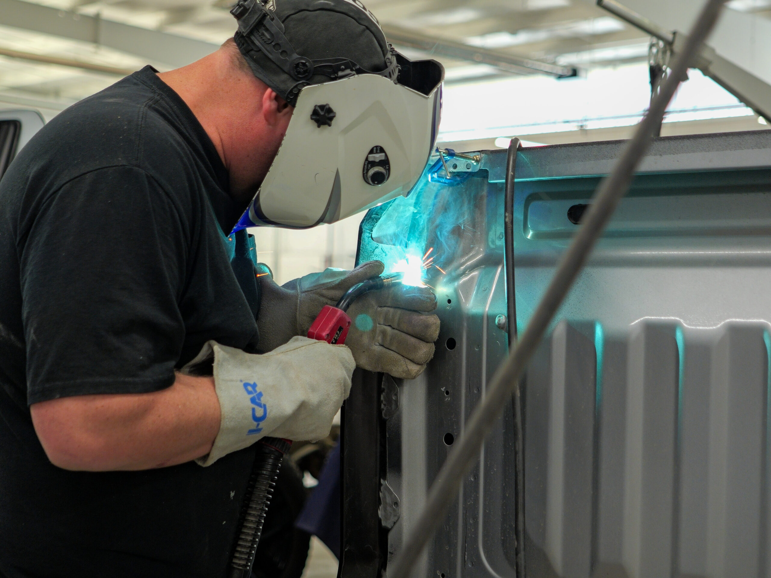 Technician working on a vehicle at Jim Winter Auto Body