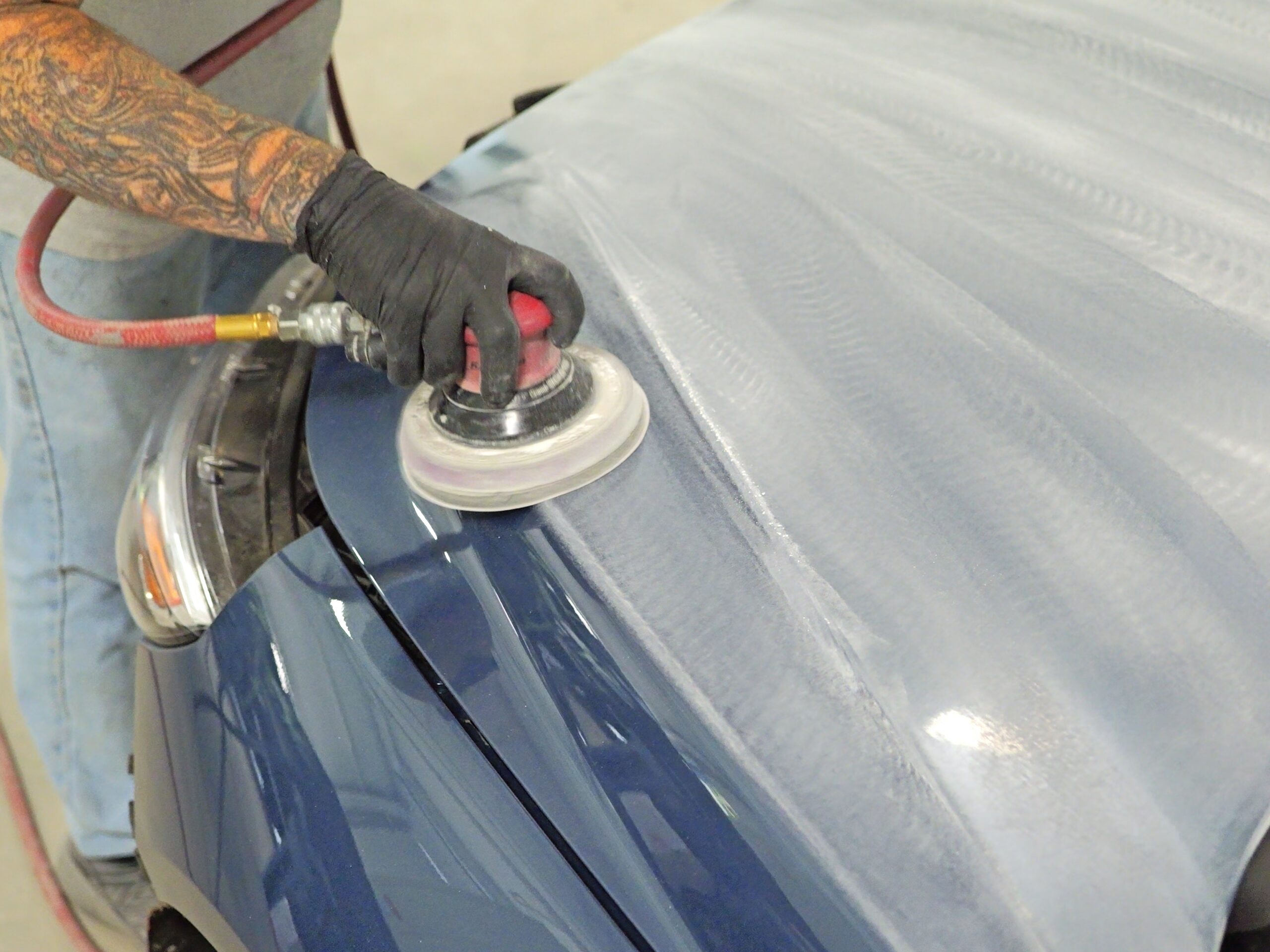 Technician applying 9H Ceramic Coating at Jim Winter Auto Body